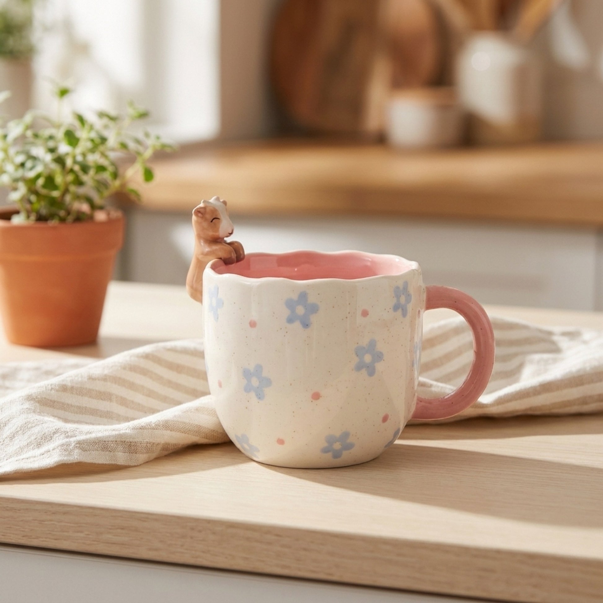 Peeking Goat Mug on a kitchen counter with striped tea towel