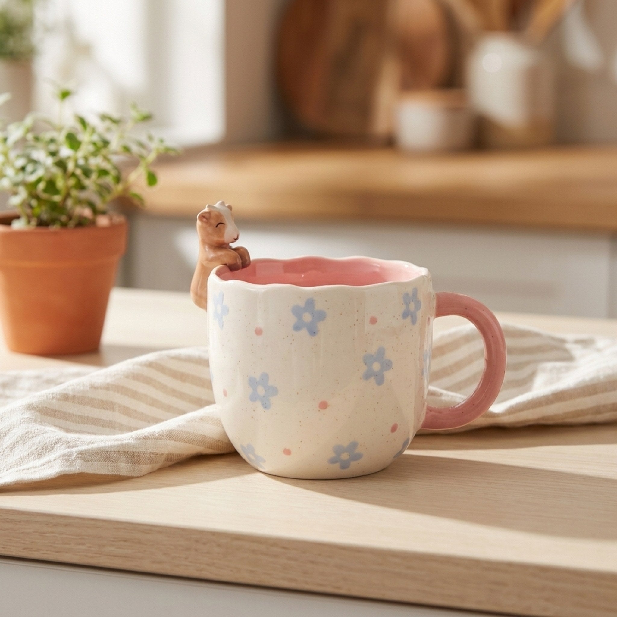 Peeking Goat Mug on a kitchen counter with striped tea towel