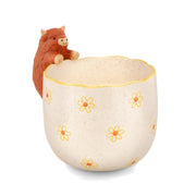 Peeking Highland Cow Planter with yellow daisies on a pure white background