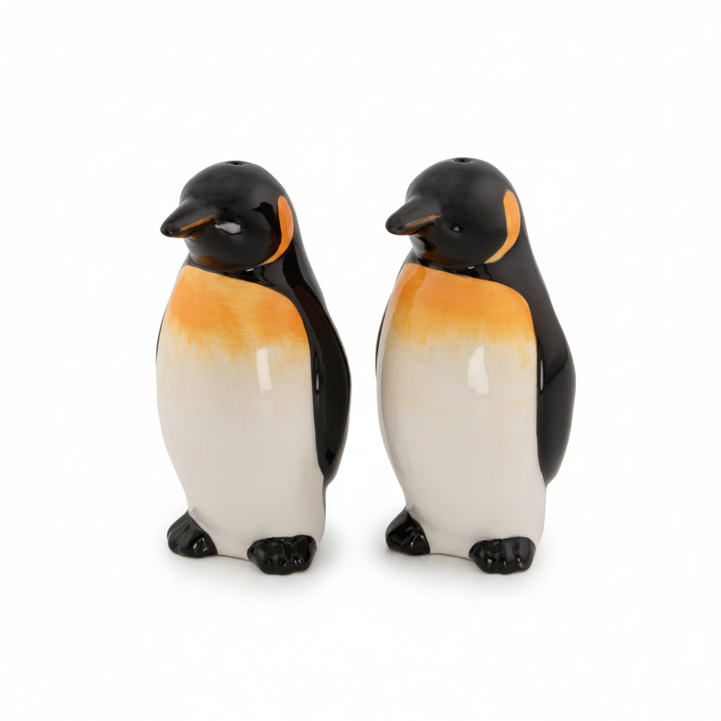 Penguin salt and pepper shakers, pair of ceramic penguins, front view on white