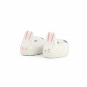 Rabbit chopstick rests at an angle, white porcelain, on white background
