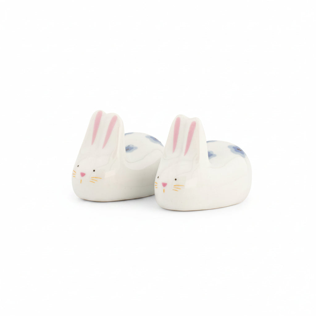 Rabbit chopstick rests at an angle, white porcelain, on white background