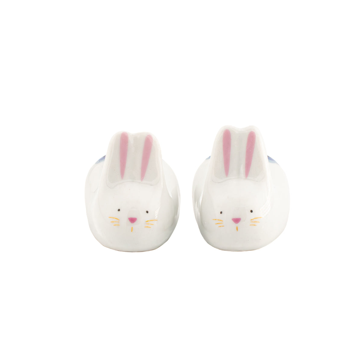 Rabbit chopstick rests, pair of white porcelain rabbits with pink ears, on white