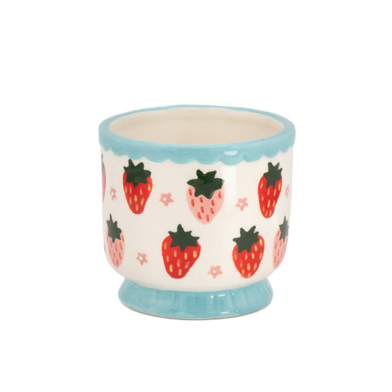 Strawberry ceramic mini planter with blue rim, empty, on white background