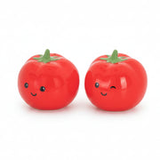 Red ceramic tomato salt and pepper shakers pair on white background
