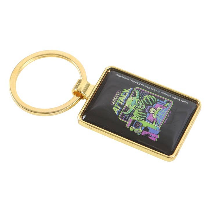 Close-up of keyring showing arcade goblins and nightmares design