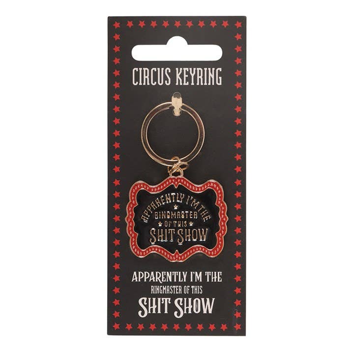 Close-up of keyring on packaging card against white background