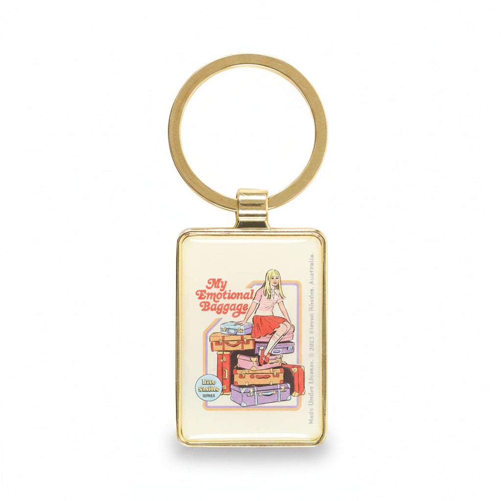 Close-up of keyring showing girl on baggage pile design