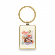Close-up of keyring showing girl on baggage pile design