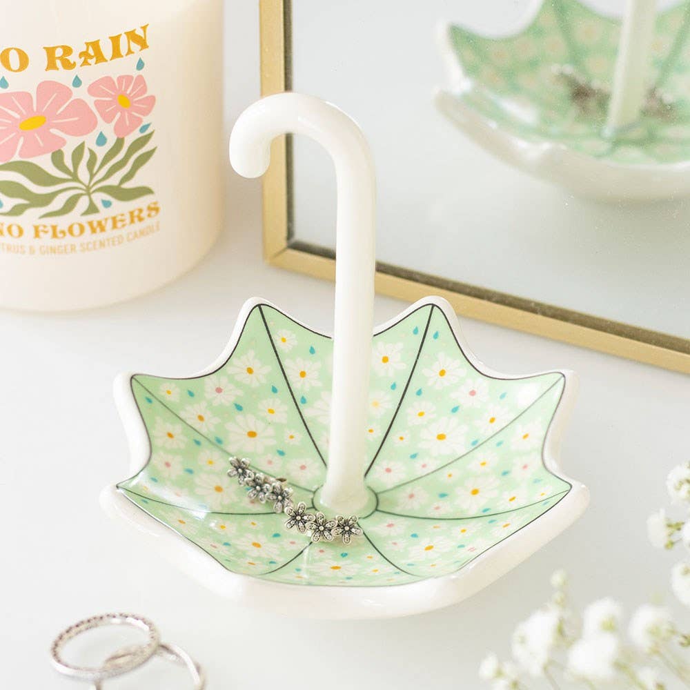 Umbrella trinket dish displayed with flowers and jewellery items
