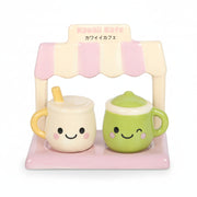 Close-up of green matcha mug and stand on white background