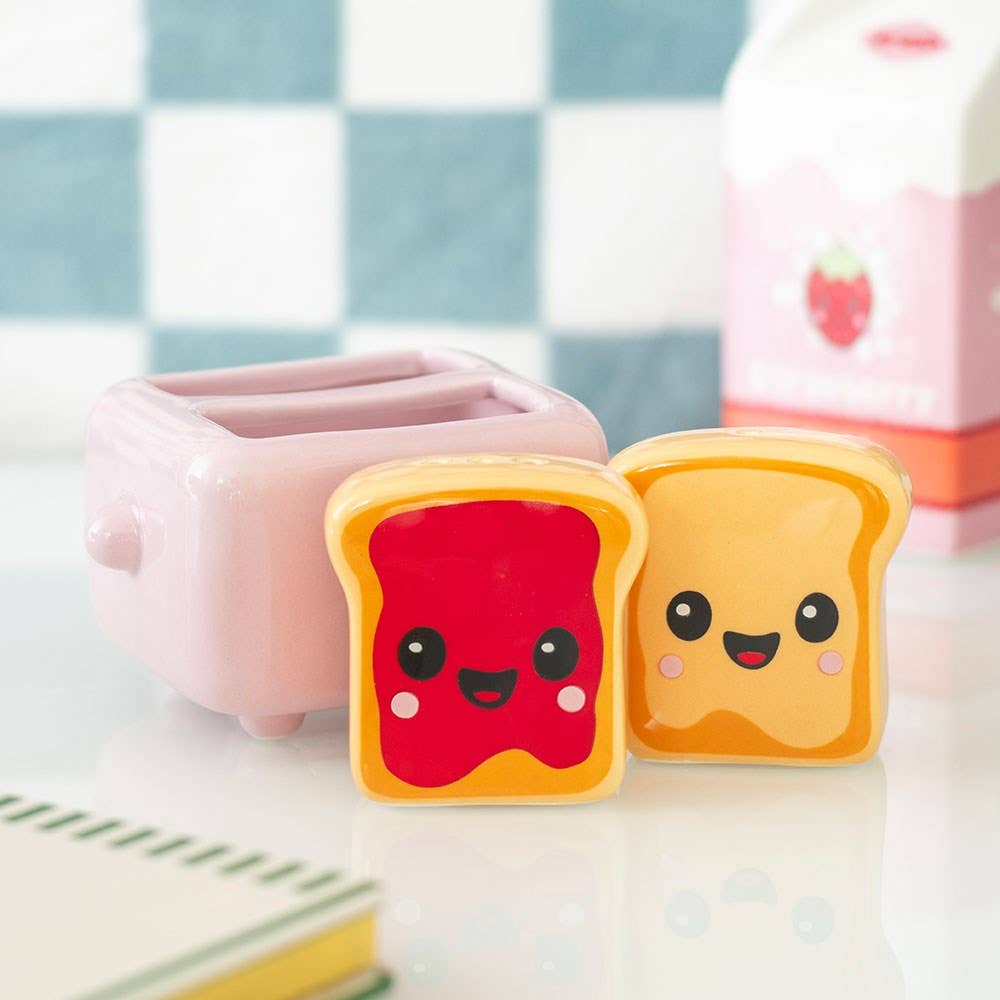 Two toast shakers in pink toaster holder on Kawaii Kafe packaging