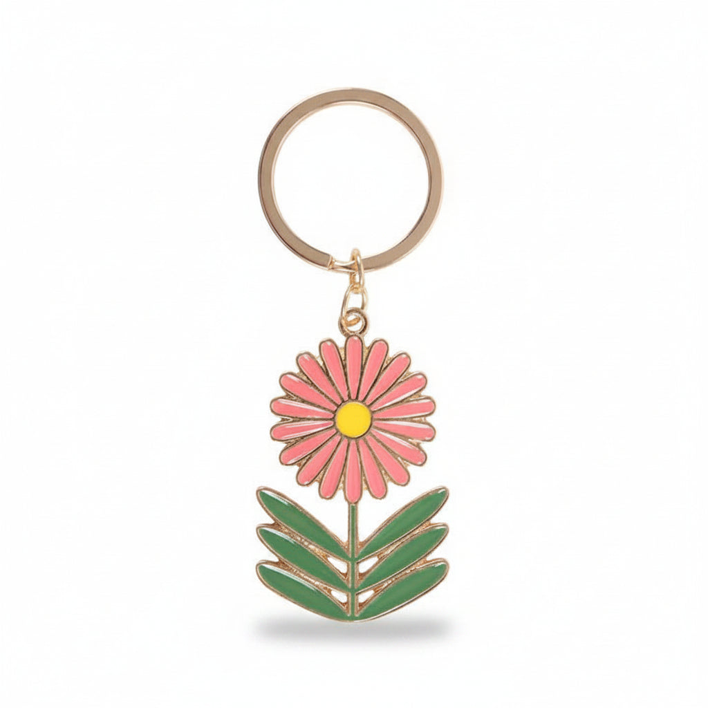 Close-up of flower keyring charm on white background