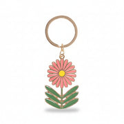 Close-up of flower keyring charm on white background