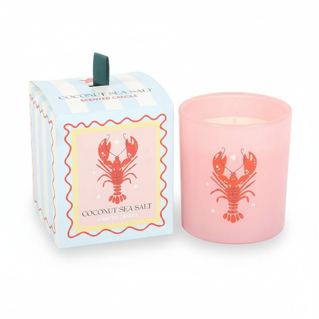 Close-up of lobster design on glass candle against white background