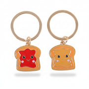 Close-up of the two keyrings on white background