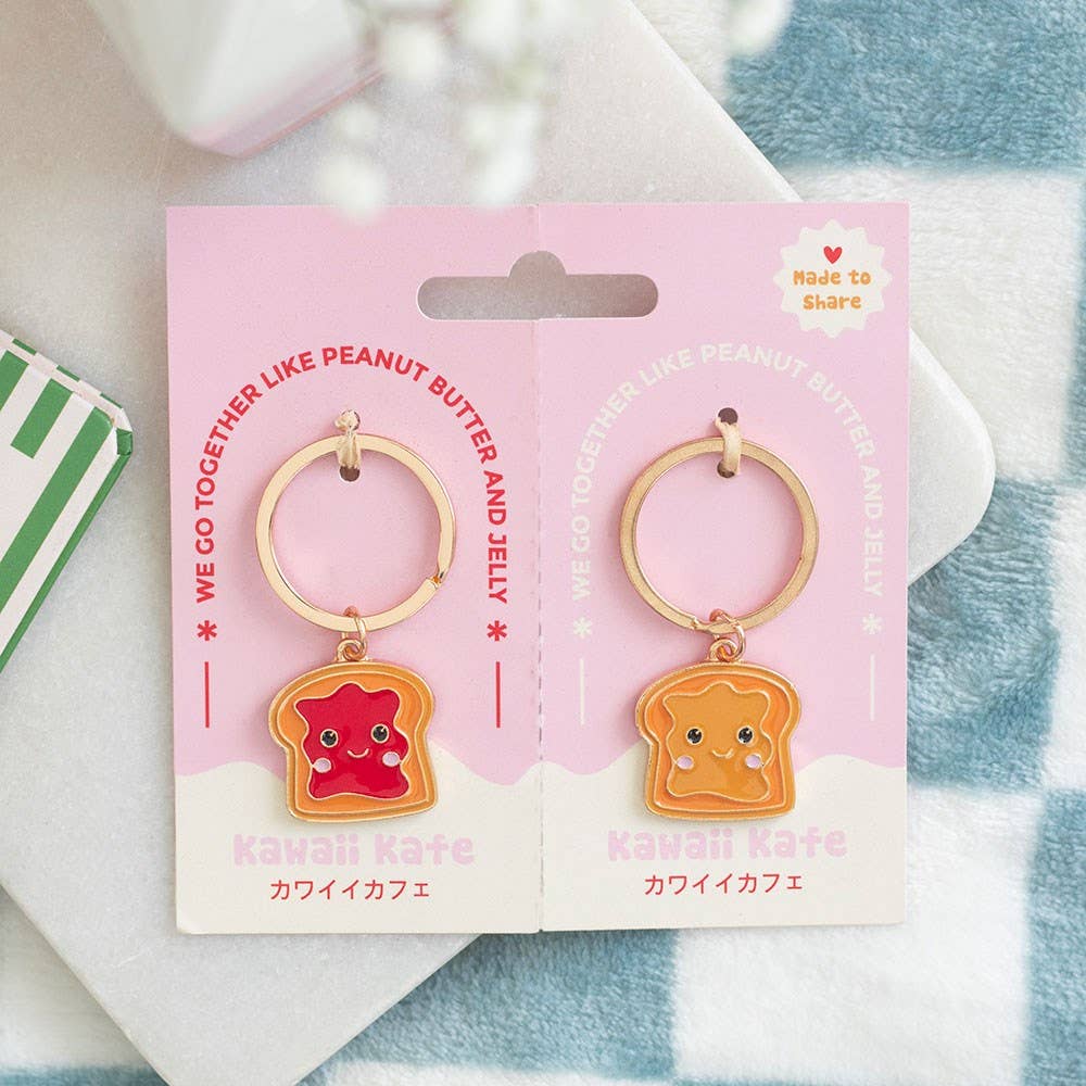 Two keyrings on pink packaging card