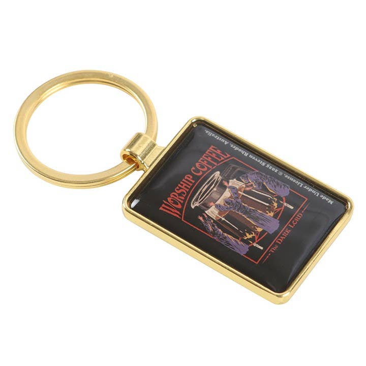 Close-up of keyring showing coffee pot and worshippers design