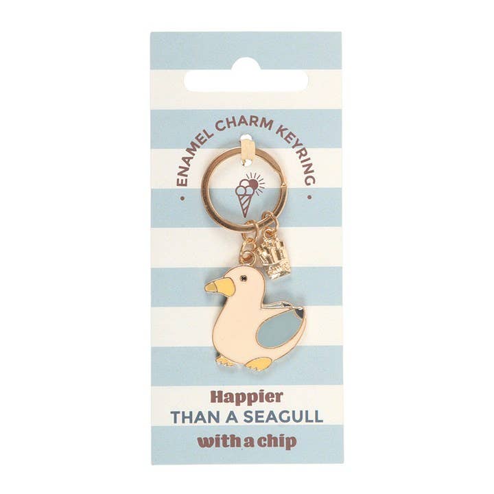 Seagull and Chips enamel keyring in coastal blue striped packaging reading “Happier than a seagull with a chip.”