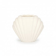Seashell oil burner in home setting with soft lighting