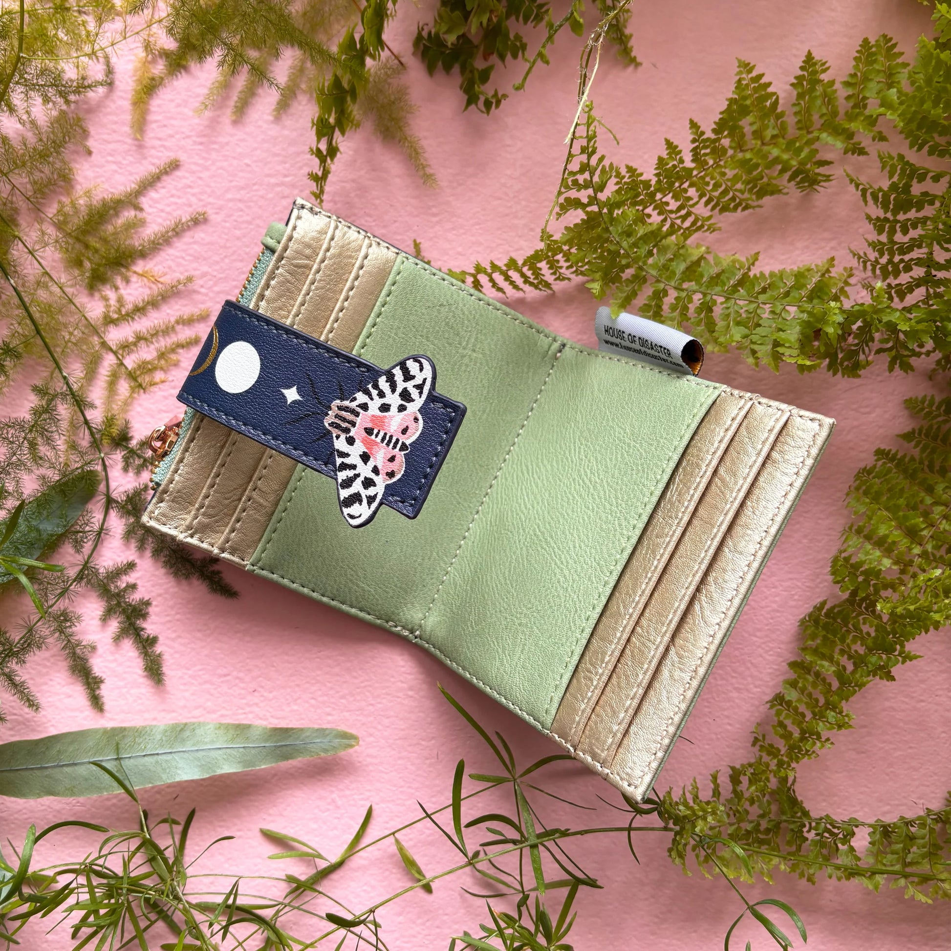 Moth foldover purse open showing green interior and card slots
