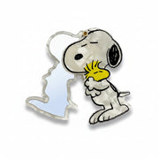 Open Peanuts compact mirror showing Snoopy hugging Woodstock design.