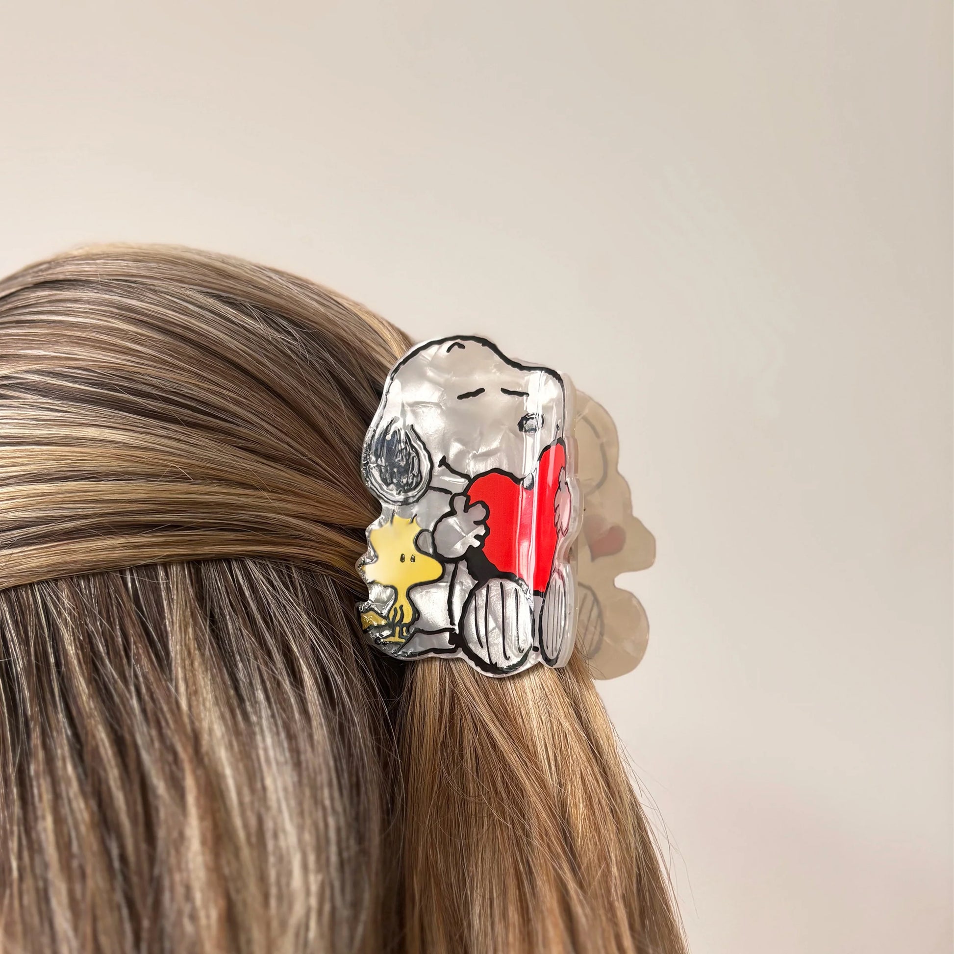 Snoopy and Woodstock hair claw worn in half-up hairstyle.