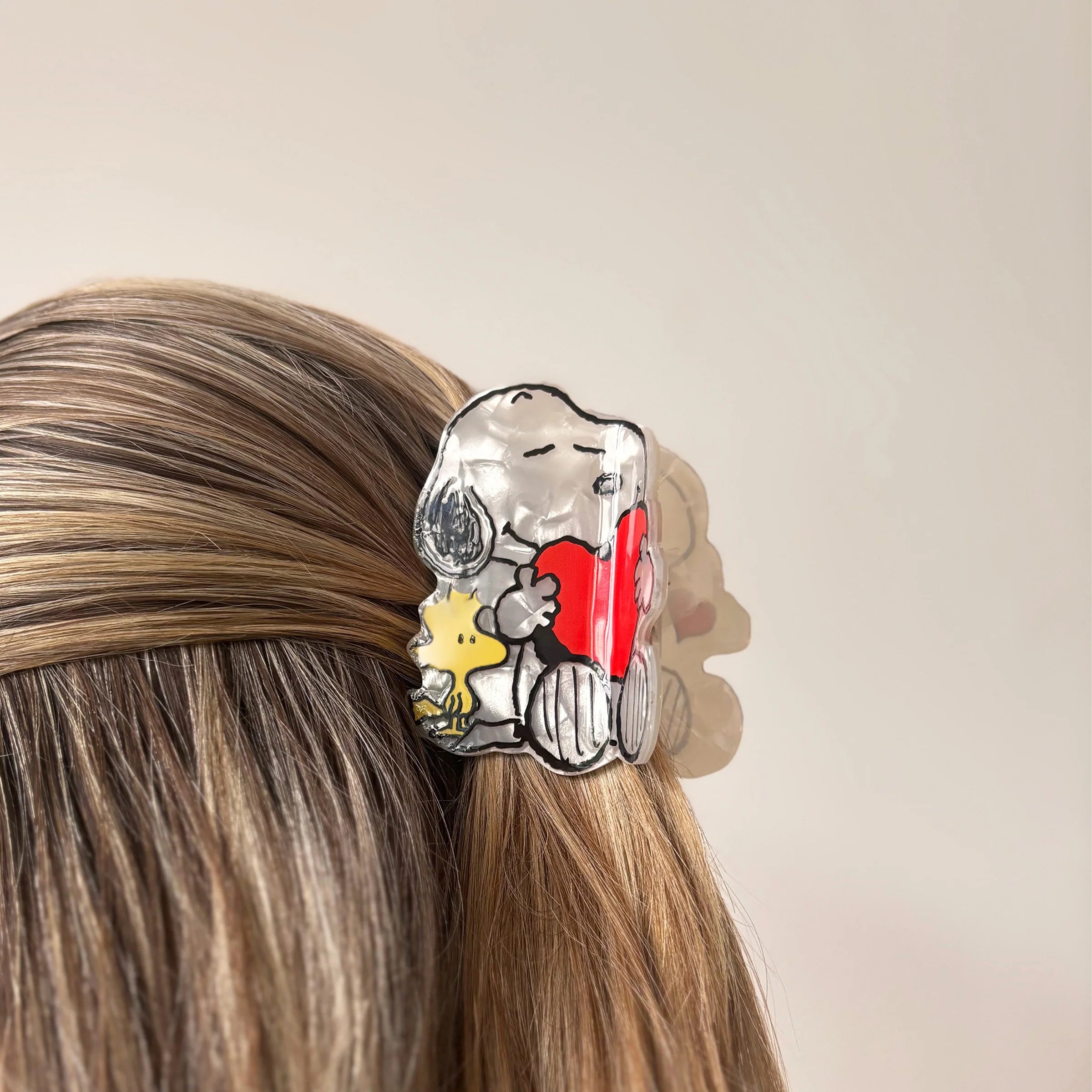 Snoopy and Woodstock hair claw worn in half-up hairstyle.