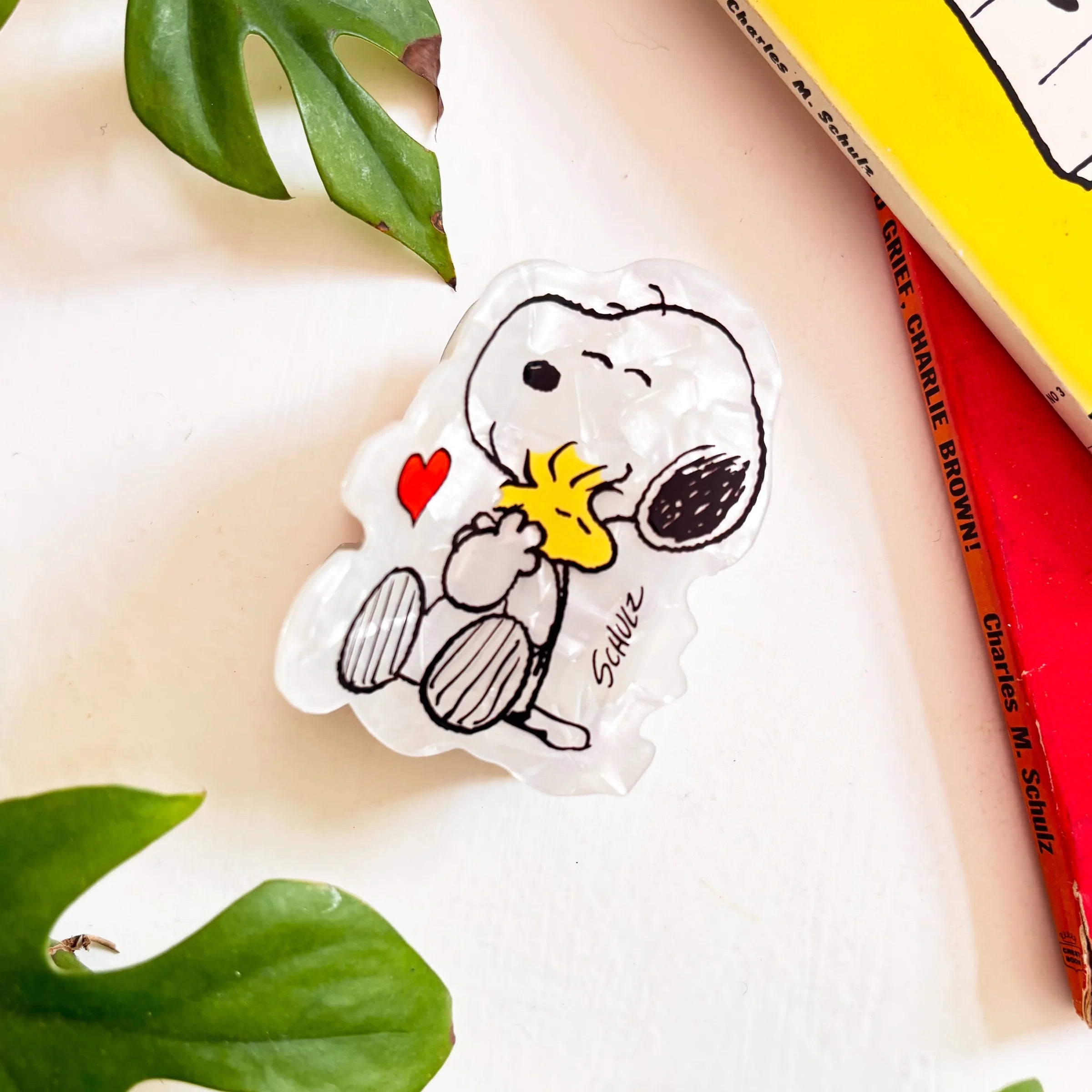 Peanuts Snoopy hair claw with Woodstock detail on white background.