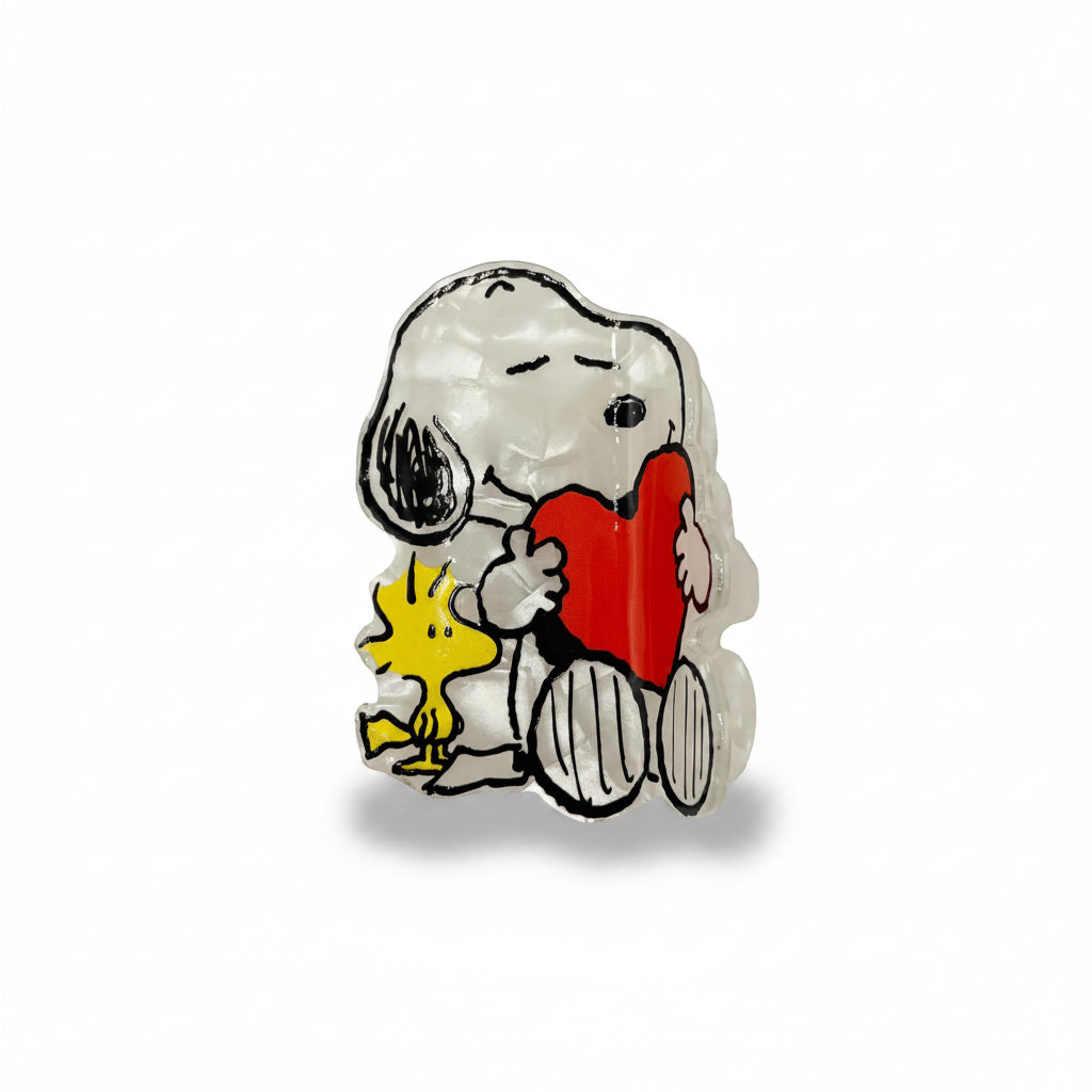 Snoopy and Woodstock PVC hair claw close-up detail.