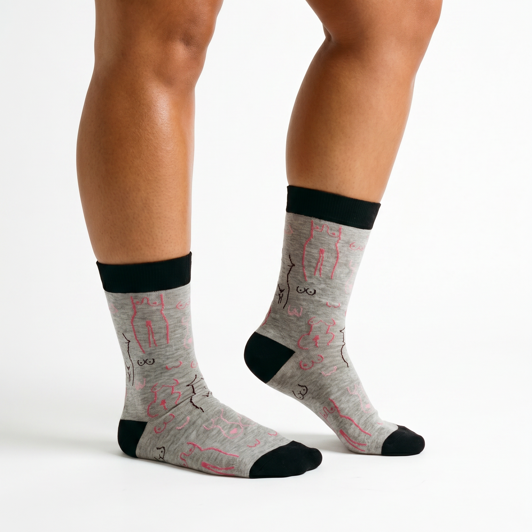 Grey boob print socks worn on a model against a pale studio background