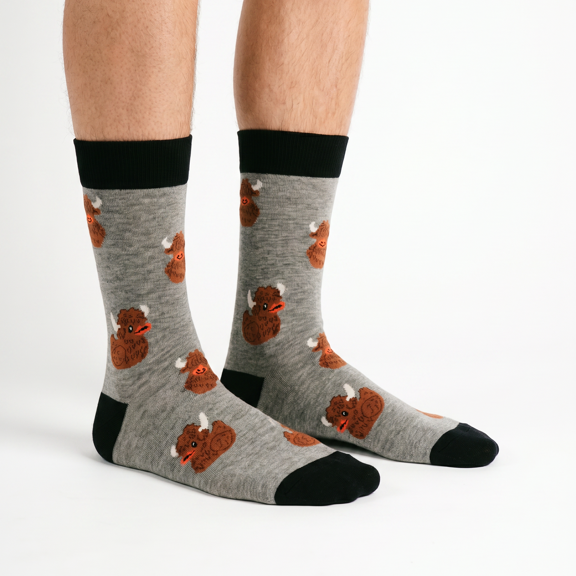 Highland coo and rubber duck socks worn, seen from the front