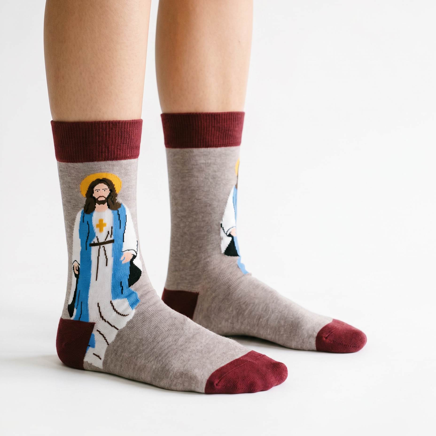 Jesus Sunday socks worn on a model against a pale studio background