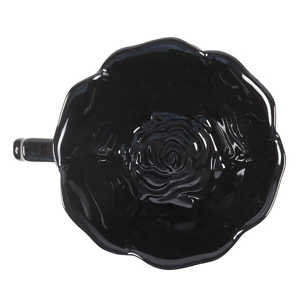 Top view of black rose relief on teacup and saucer