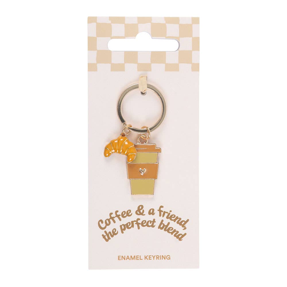 Coffee and croissant keyring on printed packaging card with white background