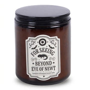 Eye of Newt amber apothecary candle on a white background