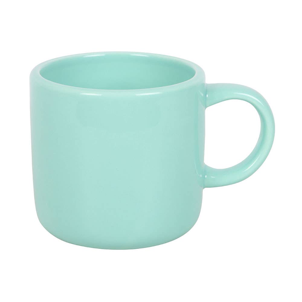 Back view of plain mint green ceramic mug on white background