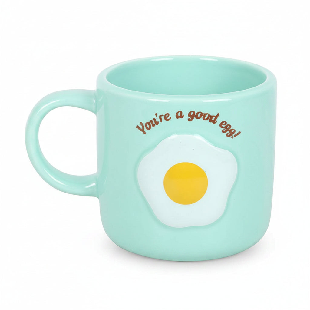 Front view of mint ceramic good egg mug with embossed fried egg and slogan