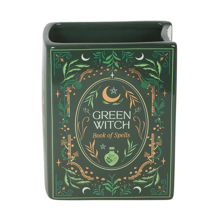 Green Witch ceramic book vase close-up showing celestial cover artwork
