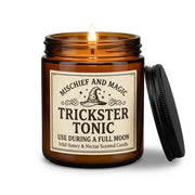 Mischief and Magic amber jar candle on a white background