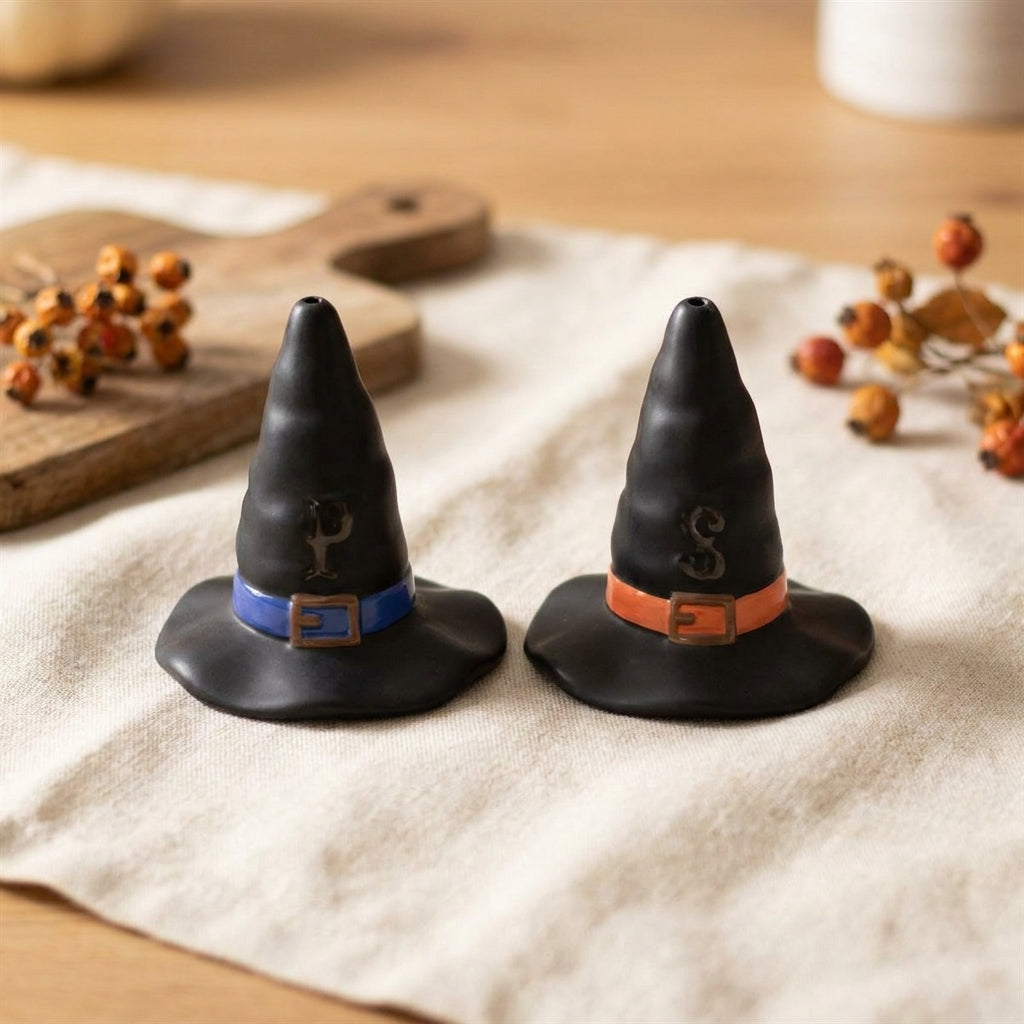 Witch hat shakers styled on a linen tabletop