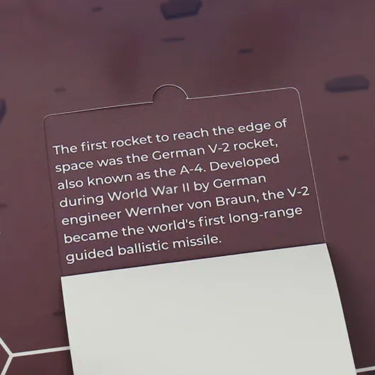 Space fact card inside pop-up board game with printed text