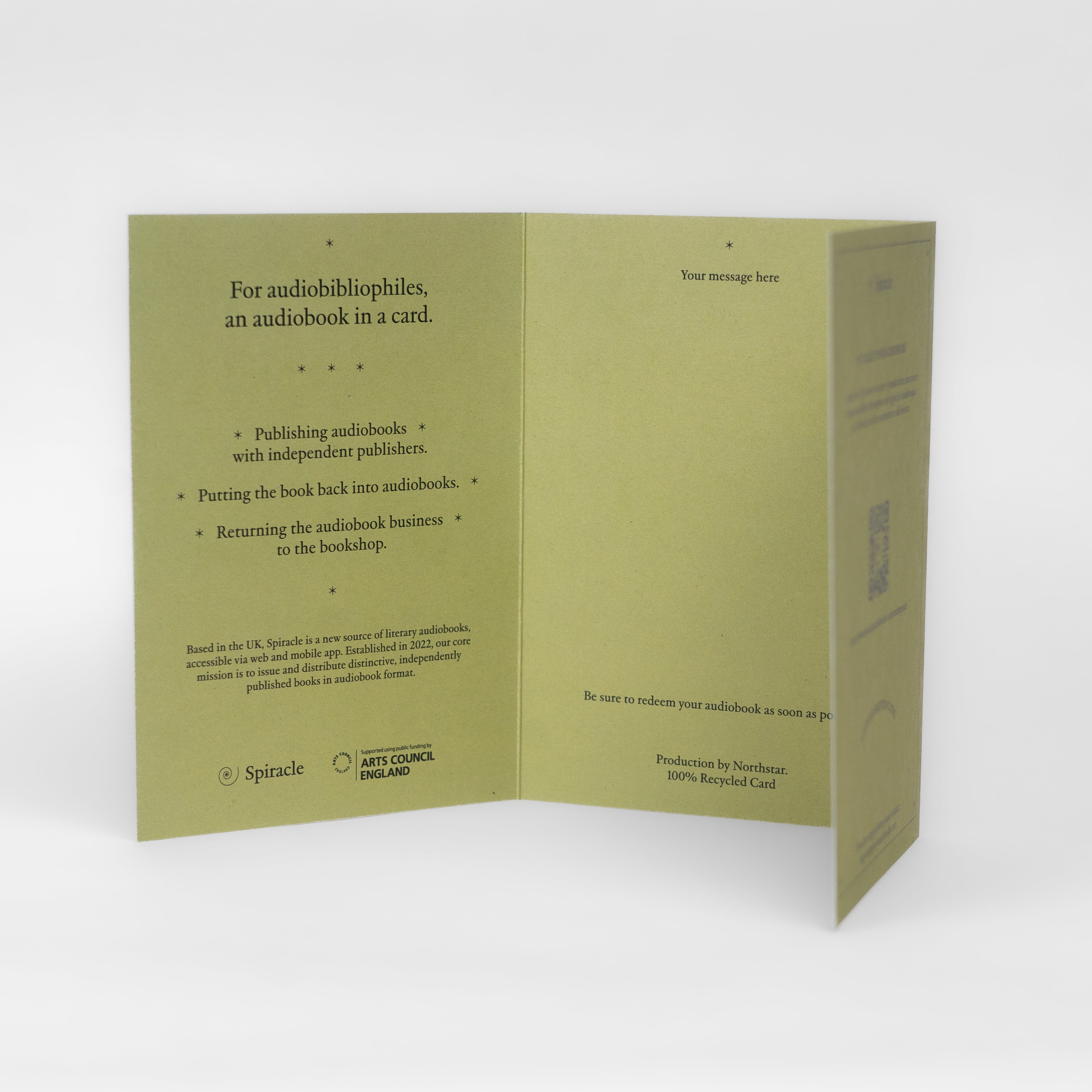 Spiracle audiobook card styled on a table with its kraft envelope
