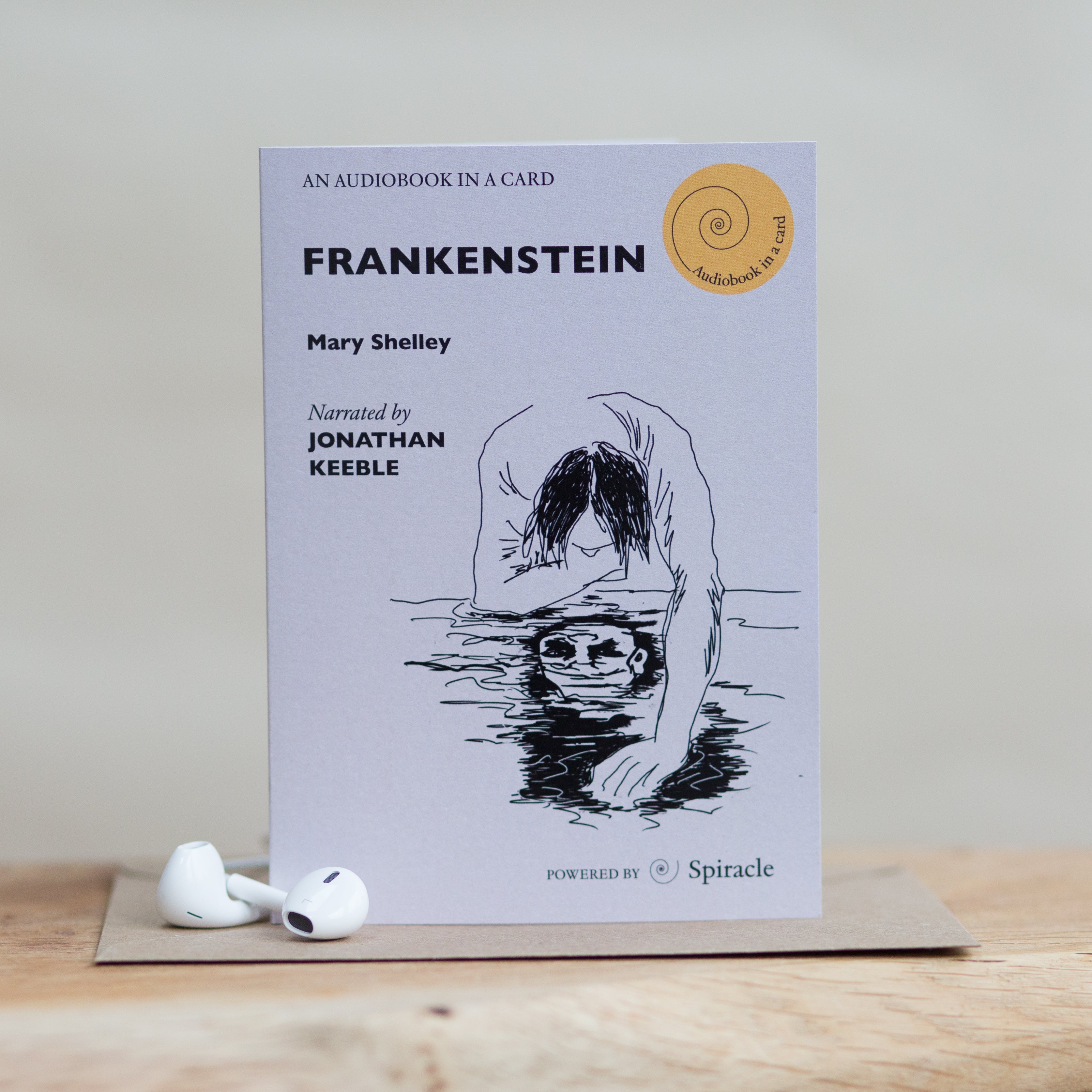 Frankenstein audiobook card styled with its kraft envelope