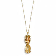 Squirrel Acorn Locket open on gold chain showing hand-enamelled squirrel detail with silver-accented acorn top.