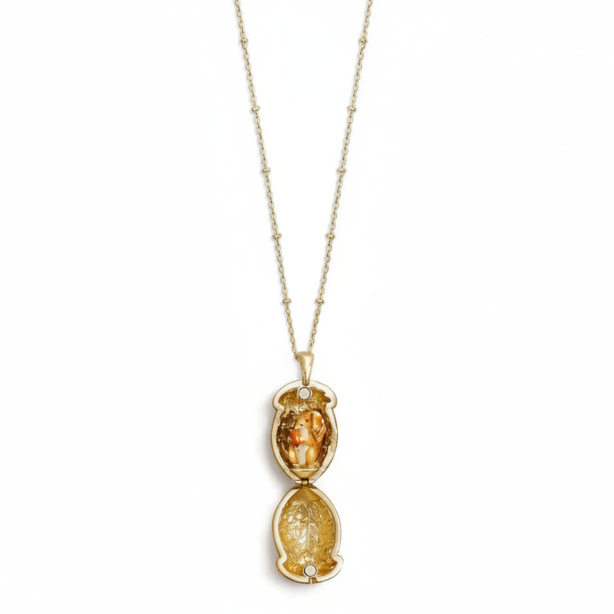 Squirrel Acorn Locket open on gold chain showing hand-enamelled squirrel detail with silver-accented acorn top.