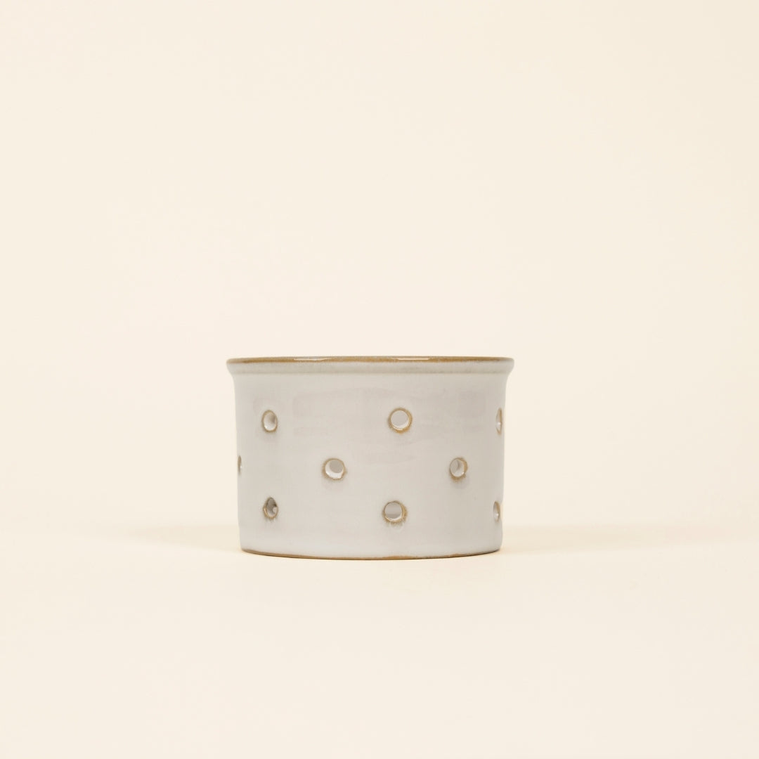 Glazed Ceramic Tealight Holder side view on a cream background