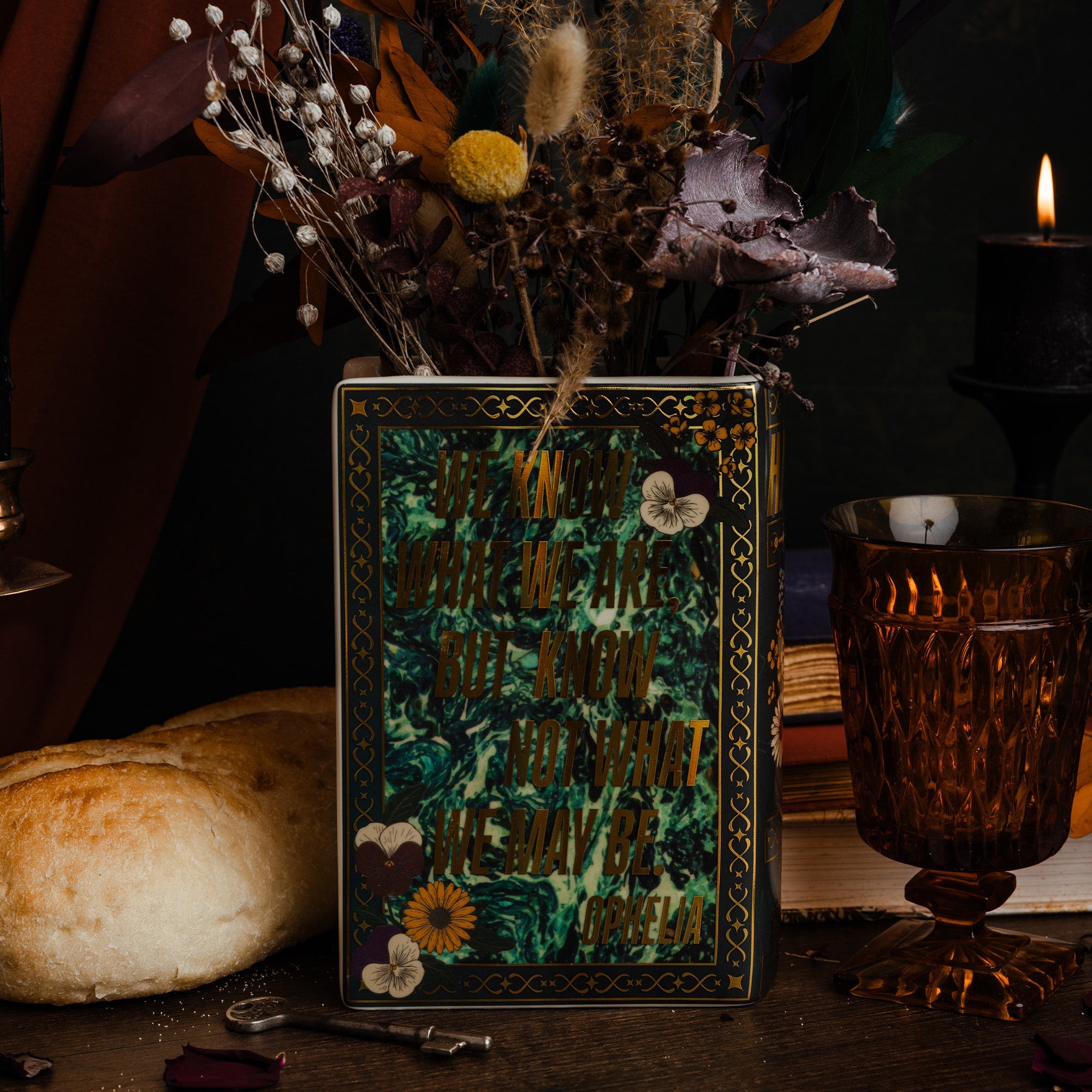 Back view of the black Hamlet book vase with dried flowers