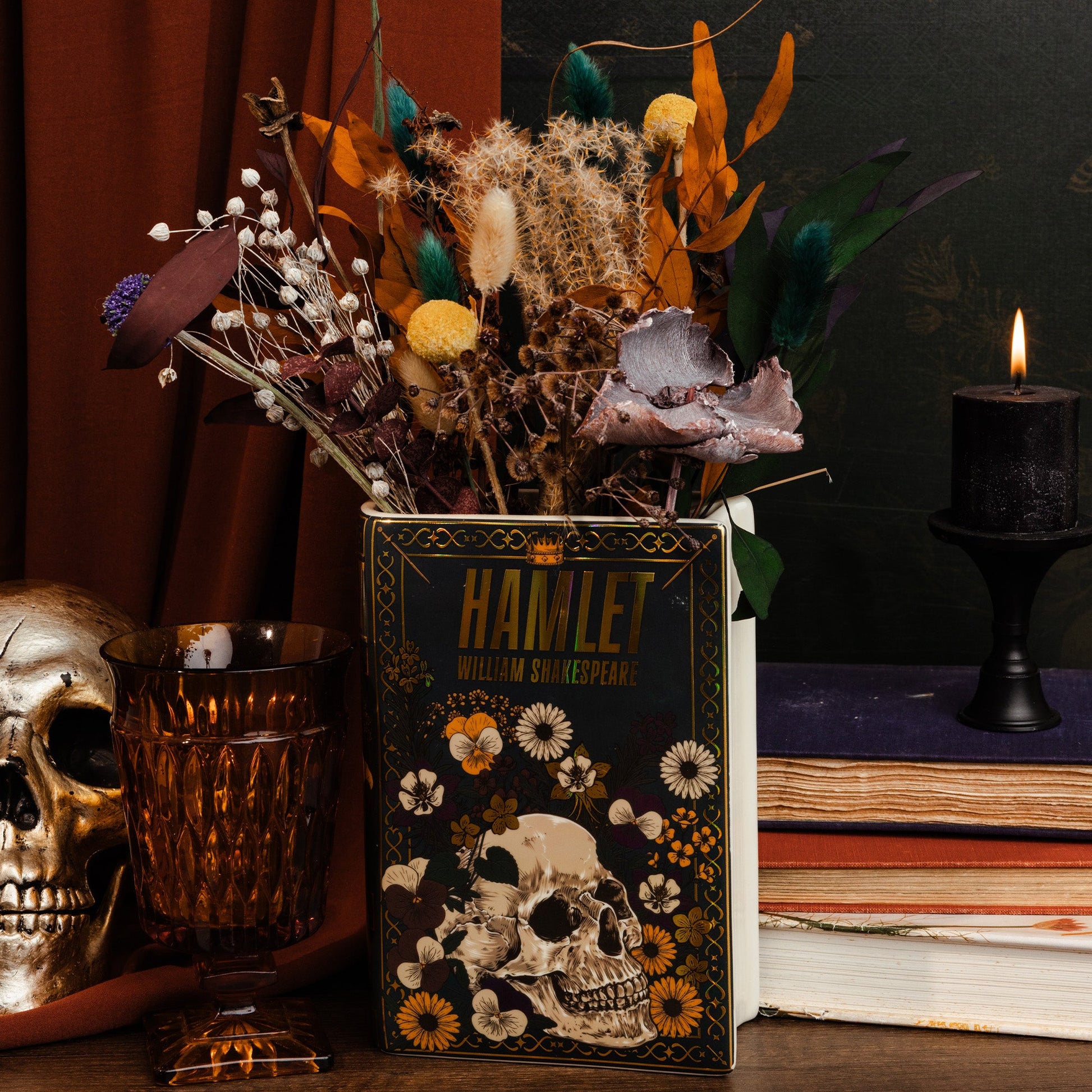 Black Hamlet book vase holding dried flowers