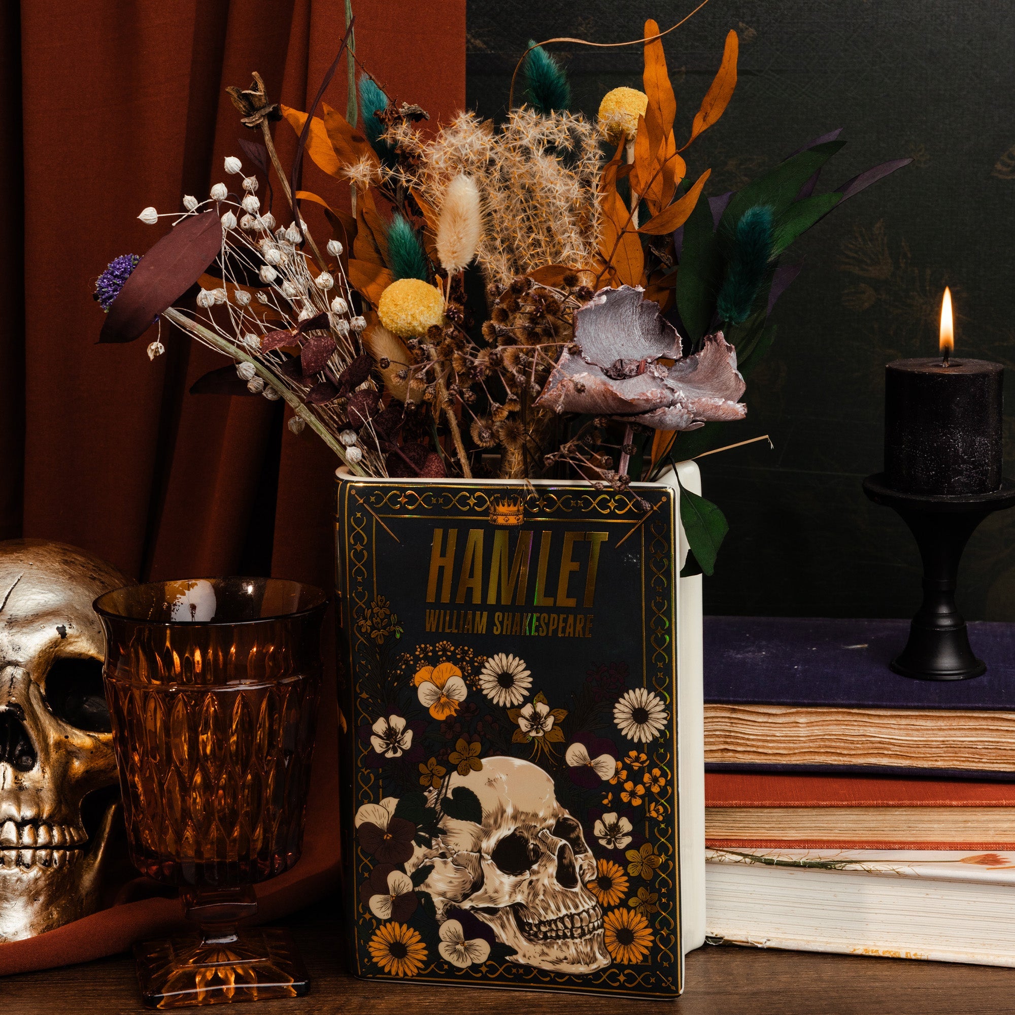 Black Hamlet book vase holding dried flowers